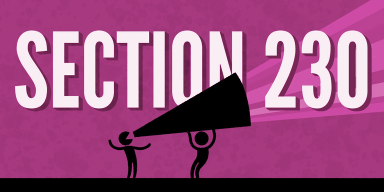 One person holds a megaphone for another, with rainbow stripes